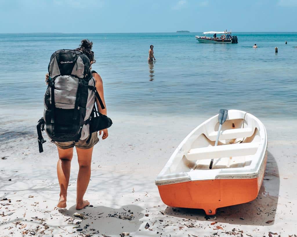 A sustainable traveler on beach. Sustainable holiday