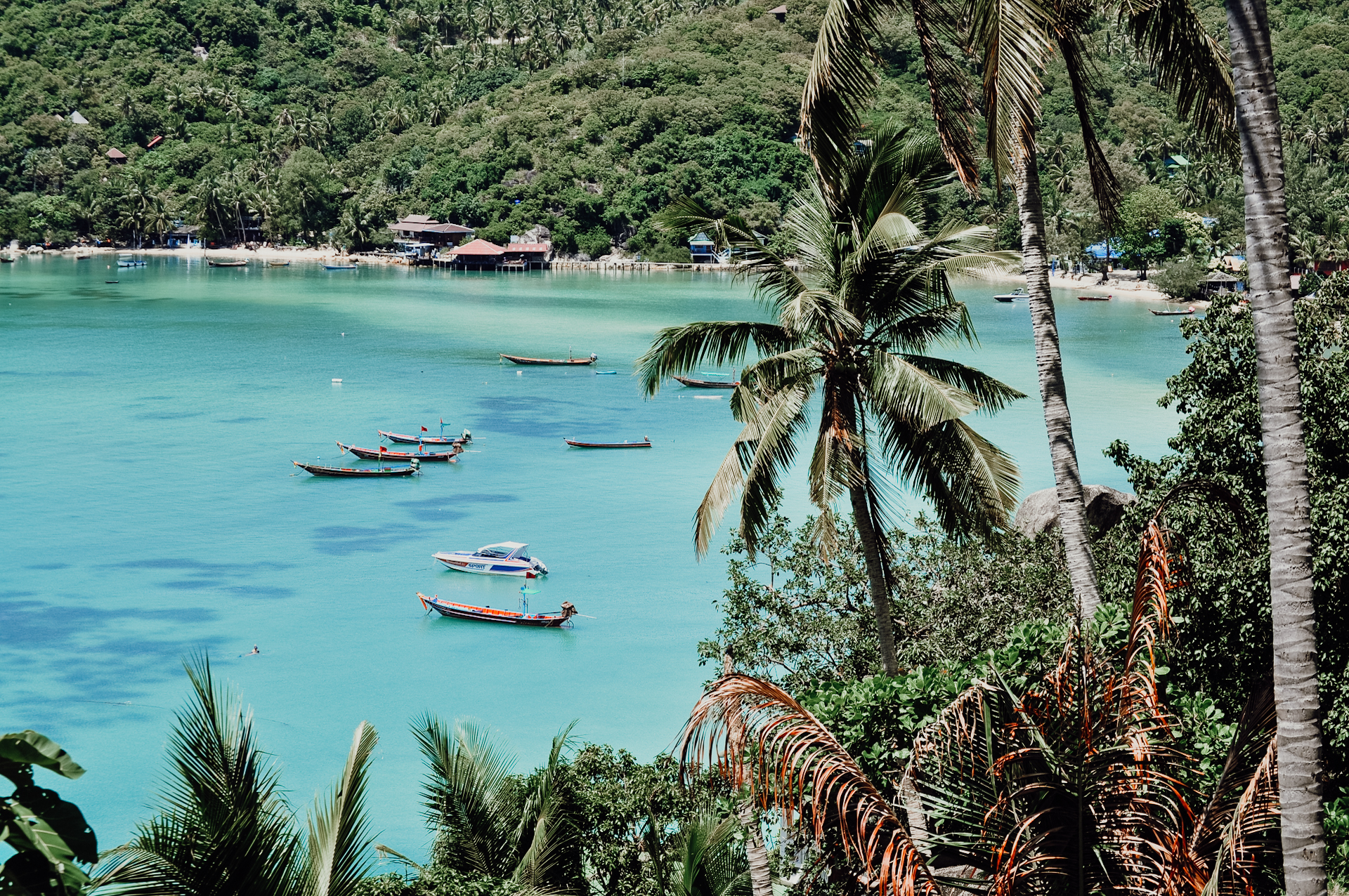A bay with boats on our backpacking Thailand itinerary