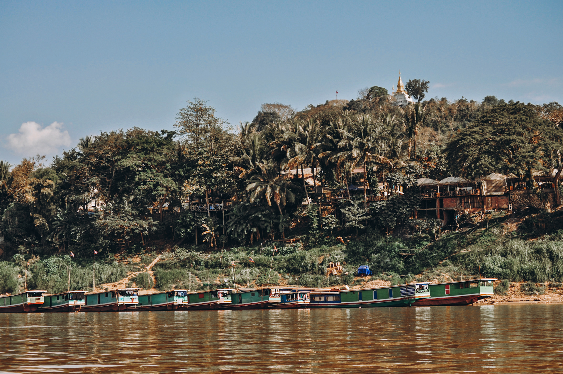 Slow boats in Luang Prabang, while backpacking in Laos